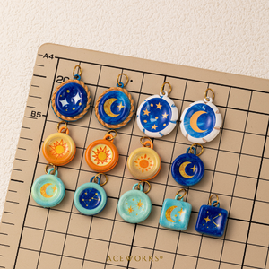 Cuaderno de Dibujo Celestial |   Dijes de Sol, Luna y Estrella de Acero Inoxidable con Esmalte Pintado a Mano y Baño de Oro PVD de 18K |   Colgantes Impermeables y Resistentes al Deslustre - Product Image 5