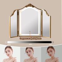 Miroir de maquillage Art Déco doré sculpté en forme d'arche, pliable en trois parties, avec lumière LED tricolore et interrupteur tactile, 31x23 pouces