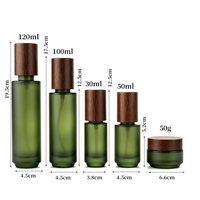 Flacons de crème pour les yeux en verre vert foncé, flacons de lotion et de spray avec bouchon en bois, fabrication directe d'usine OEM, pour ensemble de soins de la peau