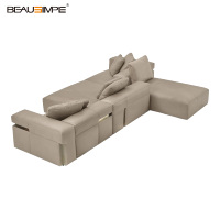 Canapé modulaire de luxe italien Bold Sofa en tissu en forme de L avec pieds en métal et rembourrage en éponge pour salon