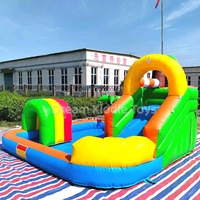 Structure gonflable multicolore palmier avec toboggan, piscine à balles et aire de jeu d'escalade pour enfants, idéale pour les événements intérieurs et extérieurs