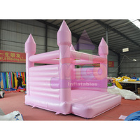 Château gonflable commercial en PVC léger, rose et bleu, avec toboggan et aire de saut