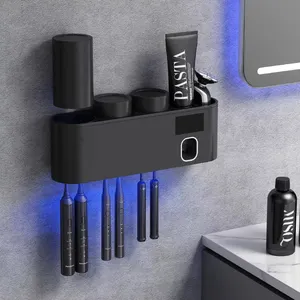 bathroom accessory set toothpaste squeezer dispenser wall mounted tooth paste dispenser with uv toothbrush holder