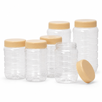 Tarro de plástico transparente al por mayor con diseño acanalado, apto para uso alimentario, contenedor de almacenamiento para cocina, tarros para mantequilla de cacahuete y tarros para chile.