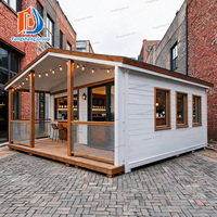 Maison conteneur pliable extensible, directement de l'usine, résistante au vent, isolée, préfabriquée, mobile, avec terrasse, toit à pignon et escalier