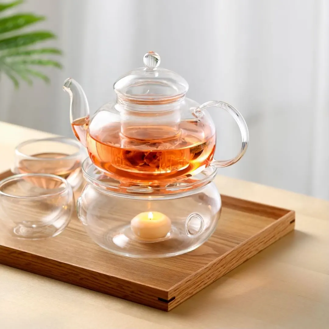 ชุดกาน้ำชาแก้วบอโรซิลิเกตแบบเป่าพร้อมที่กรองสำหรับเตาแก๊สชุดหม้อชาแก้วพร้อมที่อุ่นเทียน
