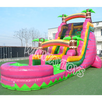 Toboggan aquatique gonflable de qualité commerciale avec piscine, motif palmier tropical, toboggan gonflable robuste pour location extérieure et événements.