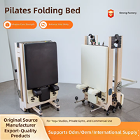 Lit de Pilates pliable en érable pour studio de yoga avec ensemble de résistance à ressorts pour les programmes d'étirement et de tonification