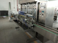Machine de remplissage automatique haute productivité pour vaseline, pâtes à haute viscosité, onguents et crèmes cosmétiques, avec ligne de bouchage multi-embouts
