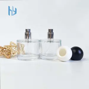 Heißer Verkauf 30ml/50ML/100ML runde schwarz/weiße kosmetische Glass prüh flasche Zylinder Custom Logo Parfüm glasflasche