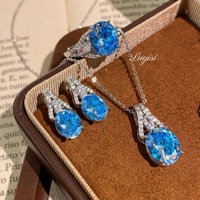 Nouvelle Collection : Parure de Bijoux Fantaisie pour Femme – Collier Pendentif Romantique Paraiba, Boucles d'Oreilles en Laiton Bleu Azur Forme Œuf de Colombe et Bague Ouverte