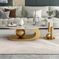 Table basse ronde pliable moderne avec plateau en marbre blanc, base en métal poli, accent sphérique réglable pour salon