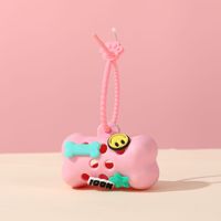 Support décoratif tendance pour sacs à déjections canines en silicone en forme d'os, distributeur de sacs à déjections pour animaux de compagnie avec conception de sac à déchirure facile, pour produits pour animaux transfrontaliers
