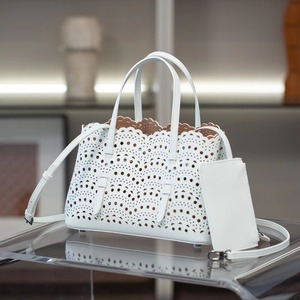 New Style Genuine Leather Unisex Luxury Soft Handbag Romantic Hollow Carved <b>Large</b> Capacity Tote <b>Bag</b> Woven <b>Beach</b> <b>Bag</b> - Product Image 1