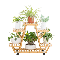 Support mobile à 4 niveaux et robuste pour décoration de jardin en bambou naturel avec roulettes, étagère pour pots de fleurs.