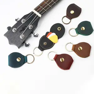 Transporte rápido Couro Genuíno Guitar Picks Case Portátil Guitar Pick Holder Keychain Case Presente para Ele Amante de Guitarra