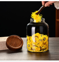 Boîte à thé en verre scellée de grande capacité pour stocker les écorces d'agrumes vieillies, avec un pot à usage domestique avec couvercle en bois fileté