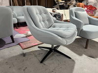 Fauteuil pivotant capitonné de style mid-century moderne, chaise en velours rembourrée avec base en métal noir