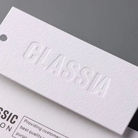 Étiquettes volantes personnalisées pour vêtements Vente en gros Papier spécial Impression sous pression Étiquette volante Impression ponctuelle universelle