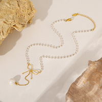 Collier ras du cou pour femme en acier inoxydable plaqué or avec perle d'imitation et chaîne à maillons en forme de nœud