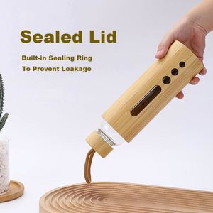 Bouteilles d'eau en verre personnalisées durables de 34 oz avec logo, couvercle en bambou et poignée de transport pour les événements de conférence et scolaires - Product Image 3