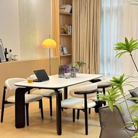 Table à manger rectangulaire moderne style crème en pierre frittée noire et blanche avec pieds en forme d'éléphant pour petit appartement ou hôtel - Vente en gros