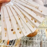 Позолоченное 18-каратным золотом ожерелье из нержавеющей стали с цепочкой в виде змеиной кости, подвесками в виде ракушек, изумрудов и бабочек, подарок для женщины