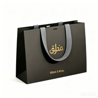 Boîte à parfum magnétique noire personnalisée de luxe, recyclable, en papier rigide certifié, avec insert pour 3 flacons vaporisateurs, finition dorée mate.