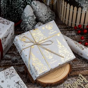 Luxurious winter-themed white-gold Christmas copperplate <b>paper</b> <b>packaging</b> with pinecone needle-like plant patterns - Product Image 3