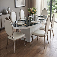 Table à manger ovale en acier avec plateau en verre, style luxe léger, base peinte, pour la maison et la restauration