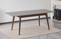 Table à manger extensible en pierre frittée avec pieds en bois massif