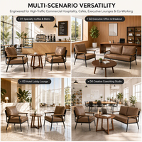 Fauteuil lounge moderne rembourré avec structure métallique et table d'appoint ronde, idéal pour les salons, hôtels, cafés et bureaux.