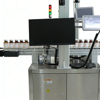 Machine de marquage laser double pour imprimer les informations sur l'extérieur de la bouteille et le code de série interne pour des marques anti-contrefaçon et traçables sur les contenants cosmétiques