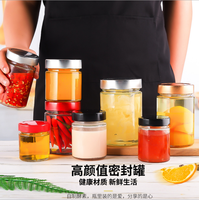 Vente en gros 30ml mini pot de miel en verre rond avec louche logo personnalisé vide pour le stockage de sucre miel confiture