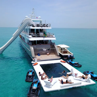 Yacht de luxe gonflable piscine d'eau protectrice anti méduse tente d'île d'océan flottante piscine de mer gonflable de natation avec filet