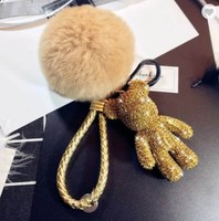 Offre Spéciale Mode De Luxe En Cuir Tressé Brin Plein Cristal Ours Pendentif Porte-clés Moelleux Pompon Porte-clés