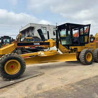 Niveleuse à moteur Cat 140K d'occasion avec lame de 12 pieds et transmission à 8 vitesses Power Shift