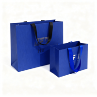 Sac en papier bleu personnalisé avec face en lin gaufré et logo en feuille d'aluminium pour la marque de magasin et la vente au détail
