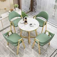 Ensemble de table à manger en marbre de luxe moderne avec pieds en métal doré, 4 chaises en cuir PU, plateau rectangulaire écologique et imperméable