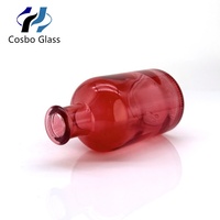 Bouteilles diffuseurs cylindriques en verre rouge en gros 50ml 100ml vides pour aromathérapie avec sérigraphie