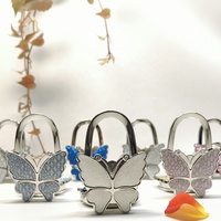 Gantungan Tas Bentuk Kupu-kupu Warna-warni Berkilau, Harga Pabrik, Bahan Zinc Alloy, Lipat, Penyangga Tas Meja