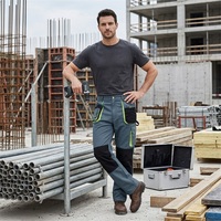 Pantalon de travail durable à blocs de couleur avec genouillères renforcées, poches cargo zippées et rangement, idéal pour les équipes d'ingénierie