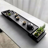 Plateaux à thé en pierre noire avec un design créatif de flux d'eau, style minimaliste moderne, utilisation domestique chinoise, table luxueuse, tapis à thé pour aquarium