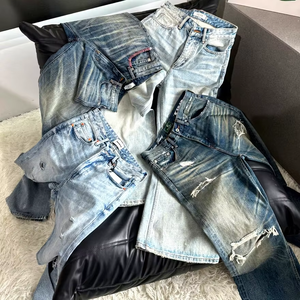 بنطلون جينز رجالي بقصة واسعة من الأسفل (Boot Cut) بخصر عالٍ، مناسب للصيف، بتصميم كاجوال، مع تأثيرات تآكل خفيفة وقماش أصلي متدرج اللون. - Product Image 1