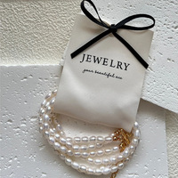 Pochettes à bijoux en gros en stock, best-seller Xiaohongshu, emballage pour boucles d'oreilles en perles, attache-cheveux en coton, minimaliste noir et blanc