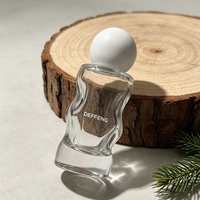 Flacon de parfum en verre unique de 30 ml et 50 ml, design courbé, avec bouchon à bille et impression de logo pour l'emballage de cosmétiques et de parfums