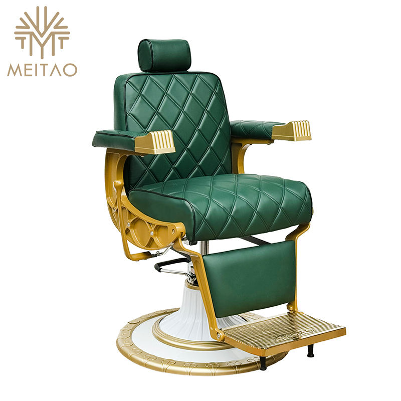 A Green Vintage Salon Barber Chair with Gold Accents, Quilted Upholstery,  and a White Base with Gold