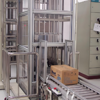 Otomatisasi Jalur Perakitan Industri dengan Elevator Pengangkat Pallet Terkontrol PLC Garansi 1 Tahun Sabuk Baja Kecepatan Dapat Diatur
