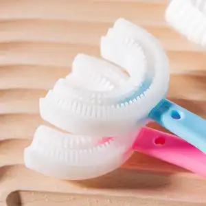 Precio de fábrica, entrenamiento Manual de grado alimenticio, cuidado bucal para niños, cepillo de dientes de silicona para bebés, cepillo de dientes para niños en forma de U de 360 grados