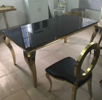 Table de réception de mariage moderne de luxe avec plateau en verre et structure en acier inoxydable doré